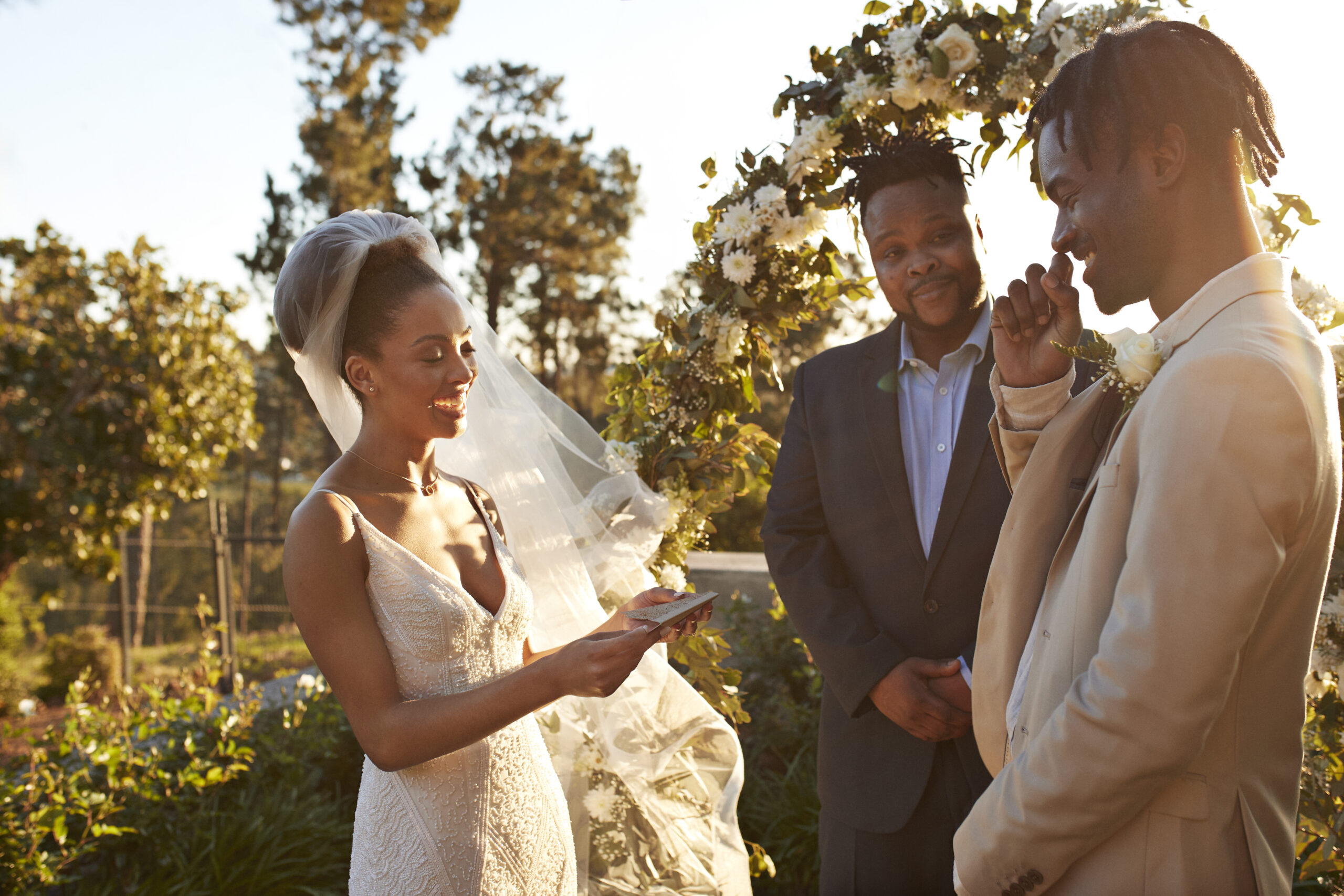 bride and groom reading vows