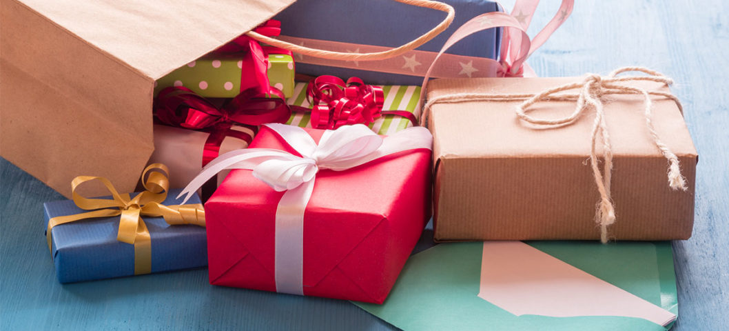 Bag full of wrapped gifts in different colors