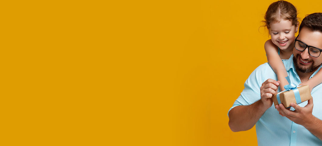 Gift ideas featuring a father opening a gift from his young daughter