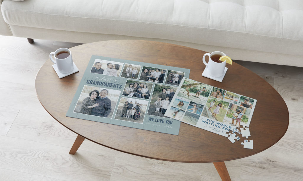 Grandparents puzzle with pictures on a coffee table with a white couch
