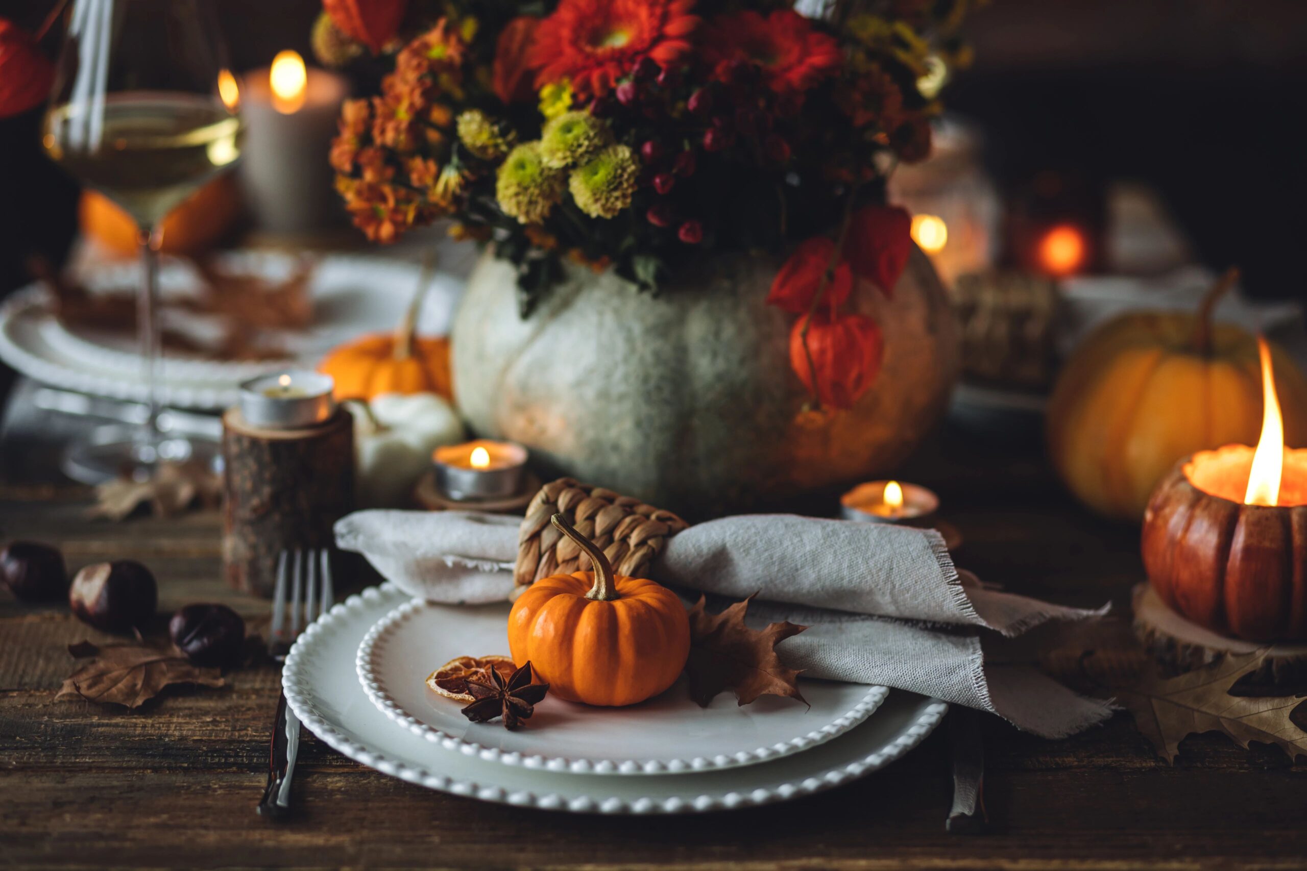 decorative thanksgiving table with a pumpkin and flowers