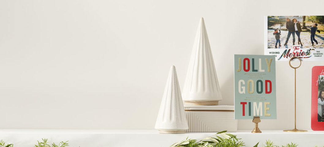 trendy photo chrismas cards on a fireplace displayed with 3 different cards