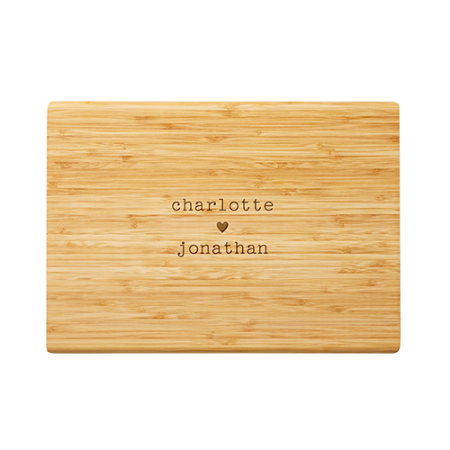 etched cutting board that says charlotte loves jonathan