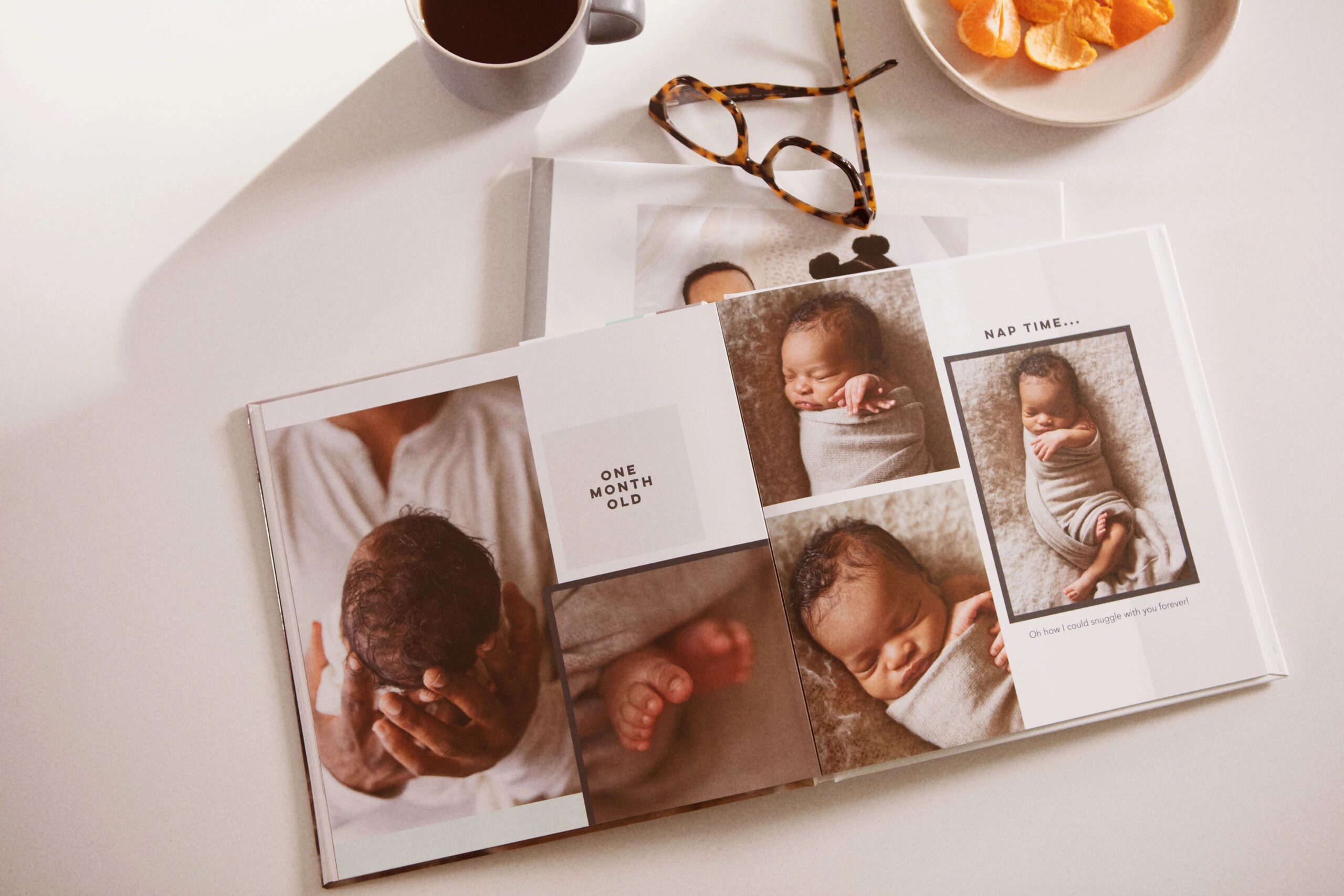 one month old baby in a baby photo album