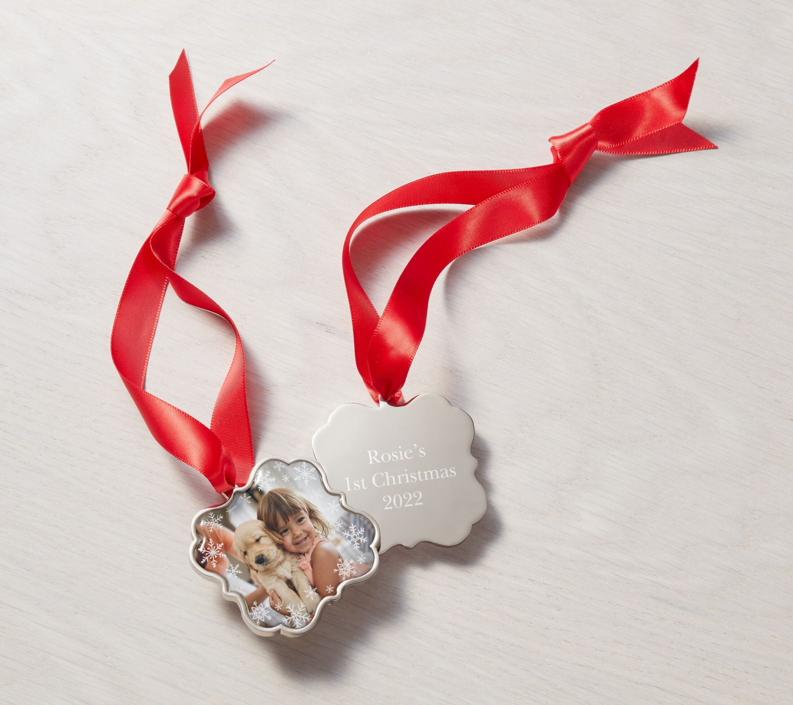 photo ornament of a little girl and her dog