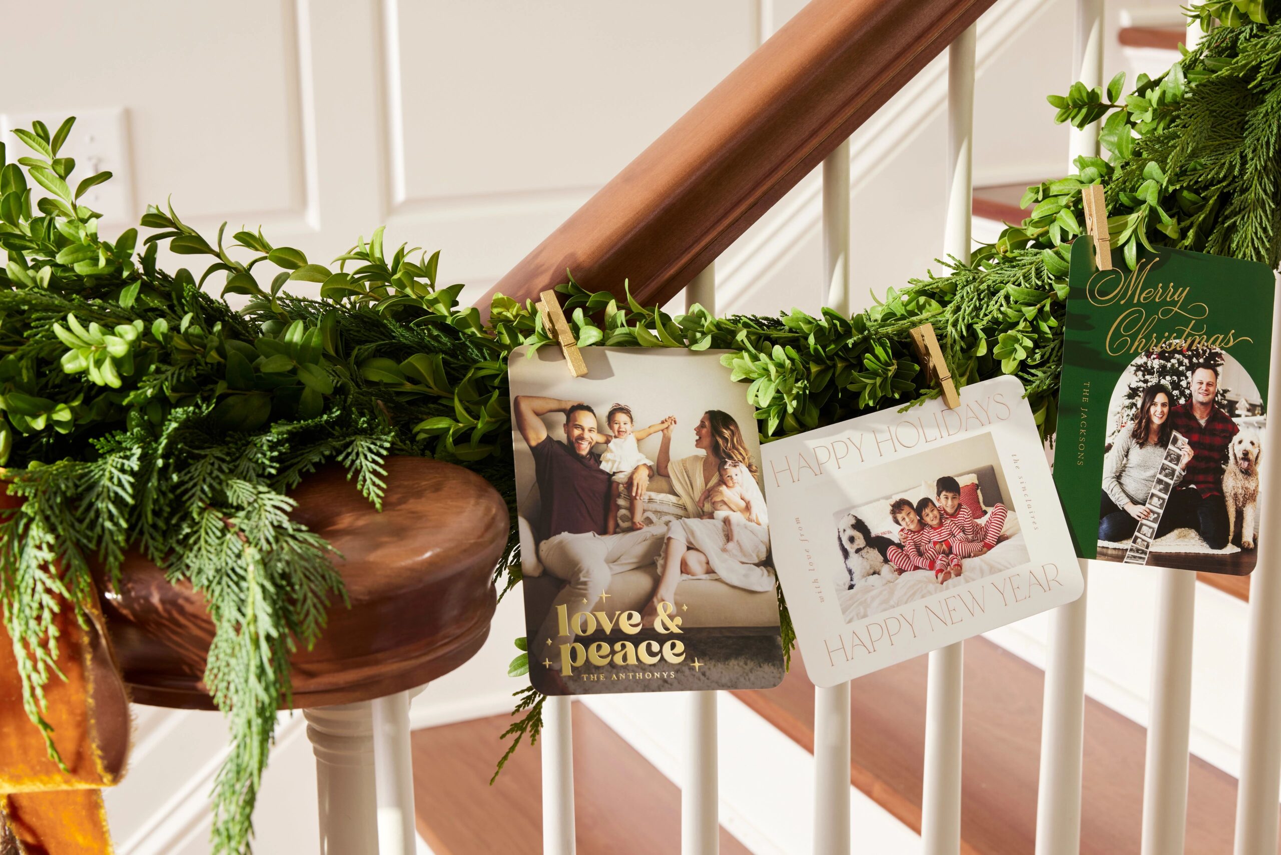 christmas cards hanging on staircase