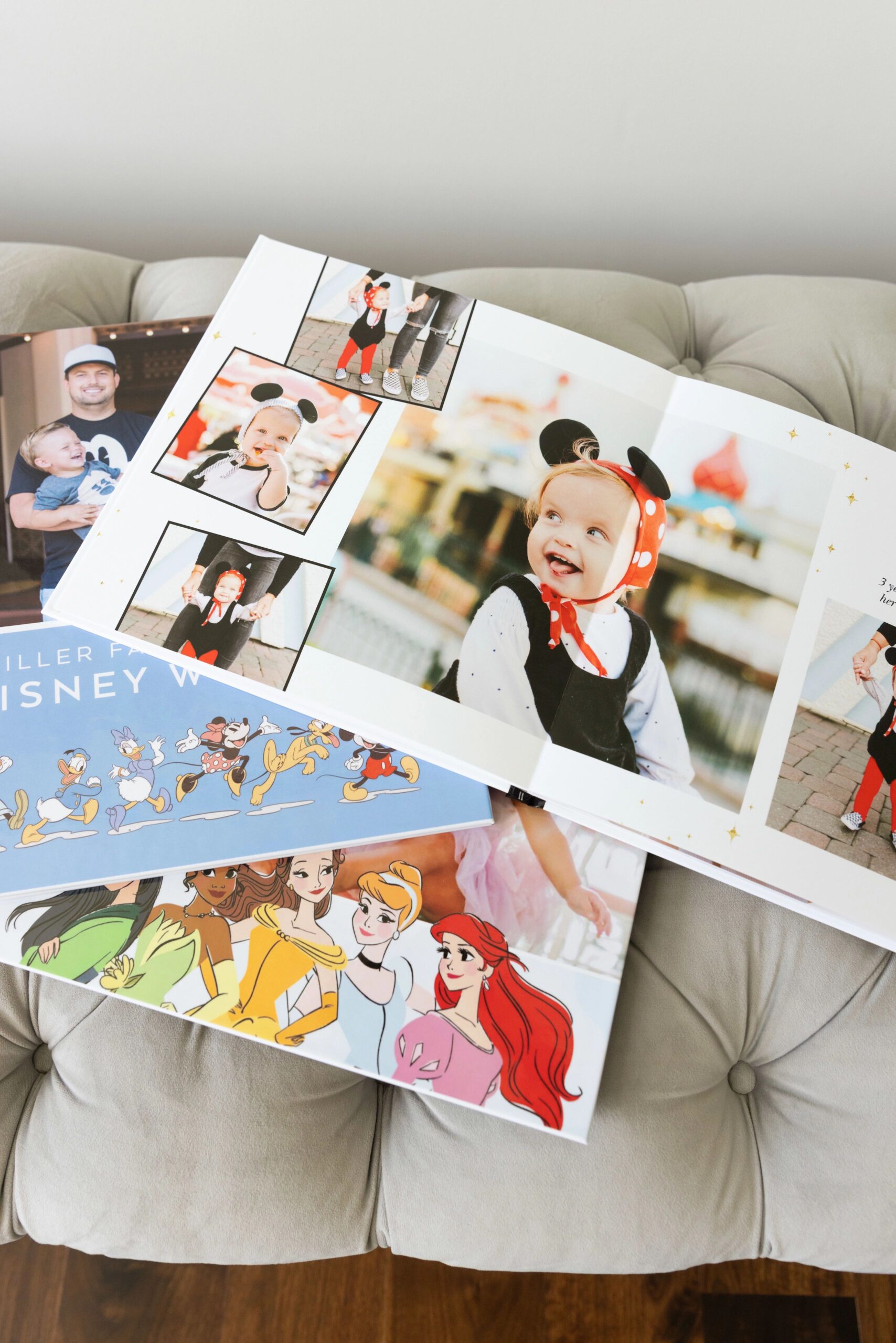 disney photo album open with pictures of disney trip