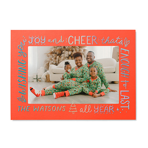 christmas card photos taken at home in matching pajamas