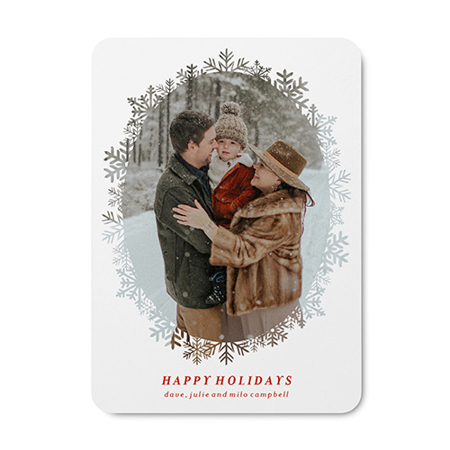 family photo in the snow on a holiday card