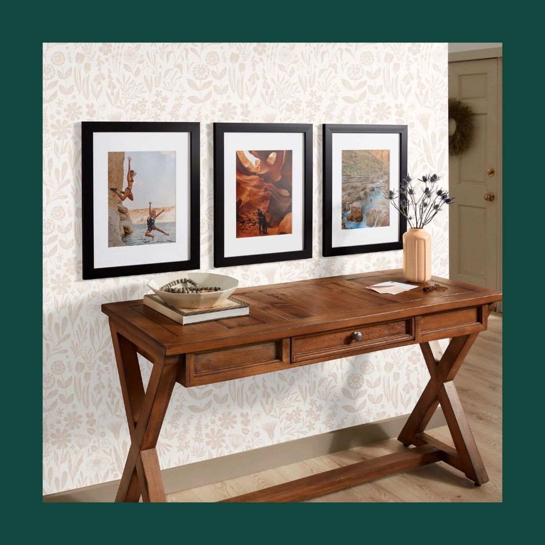 three framed prints hanging on a wall